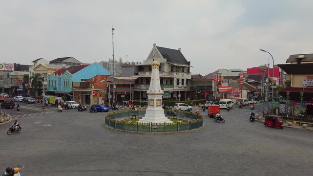 Aerial view of Tugu Yogyakarta Monument at intersection with traffic Yogyakarta, Special Region of Yogyakarta, Indonesia.