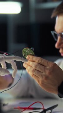 In modern lab, engineer assembles robotics circuit board using engineering design methods, checking solder joints with precision as lab equipment hums, reflecting focused development process concept