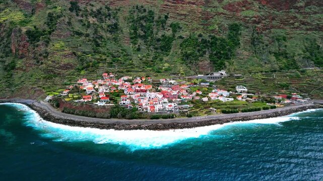 Aerial of Machico coastal town and beach, Madeira