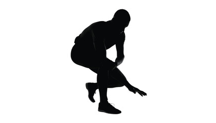 Fototapeta premium Basketball player silhouette bending down during action practice isolated on a plain white background in full studio light.