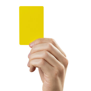 Hand holding yellow warning card for sports penalty, isolated on transparent cutout background