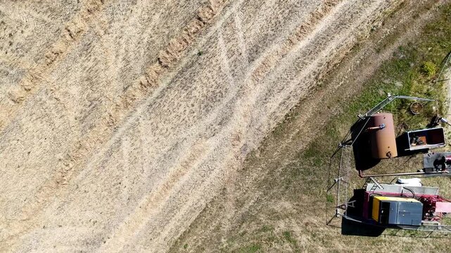 Pipeline repair occupies the scene.
Excavation exposes buried infrastructure.
Construction equipment surrounds the trench.
Drone footage captures industrial maintenance.