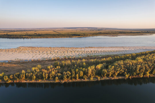 Aerial view of the low Danube with exposed sand islands and a mid-river island between Romania and Bulgaria