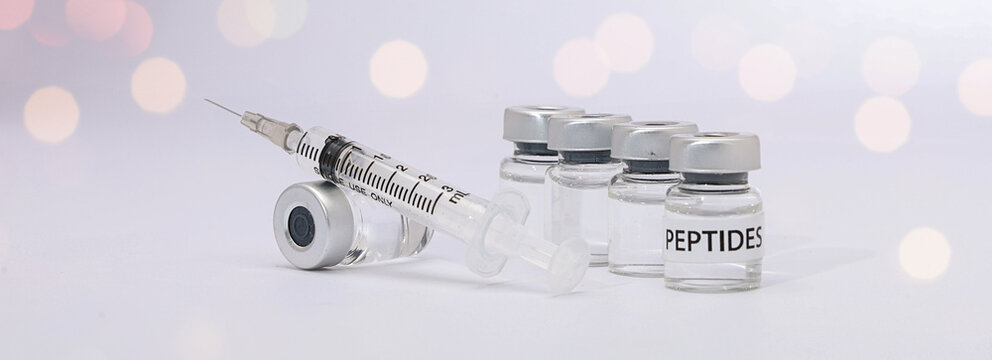 Hopeful patient receives medical peptide therapy with vial bottle syringe injection for health care treatment research
