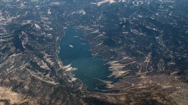 flying along Lake Davis, an artificial lake in Plumas County, California, USA, near the Sierra Nevada community of Portola, located in the Plumas National Forest, 4k aerial video footage 