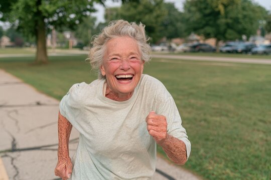 Senior Woman Jogging Full Body Candid Outdoor Portrait
