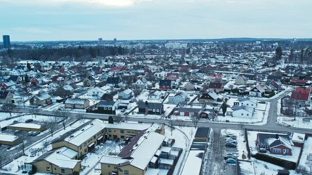 Aerial view of snowy residential neighborhood in Vaxjo, Sweden during winter