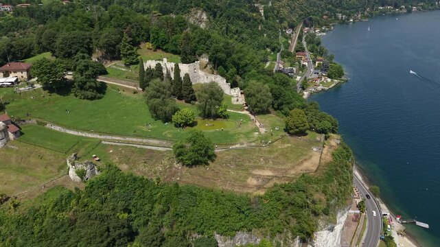 Clifftop Park Of Parco della Rocca Borromea In Arona, Piedmont, Italy. Aerial Rotate Shot