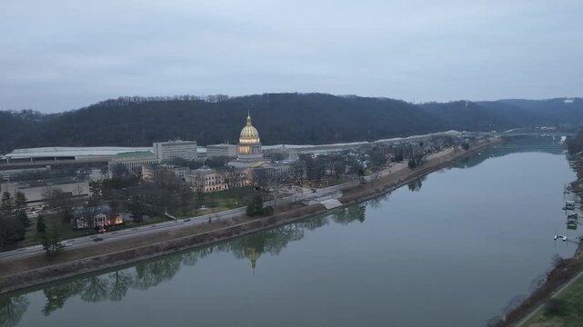 est Virginia state capitol at dawn in Charleston, West Virginia with drone video moving in a circle.