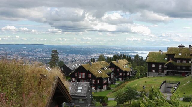 Houses in the village in Norway. Traditional grass roof homes with a view towards the city of Oslo and the Oslo fjord.