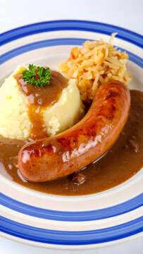 German Sausage Plate with Sauerkraut and Gravy Sauce