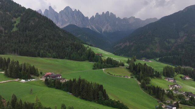 serene mountain landscape with green hills and grassy rock formations viewed from above in a panoramic setting, nature and travel content with vibrant colors and clean background.