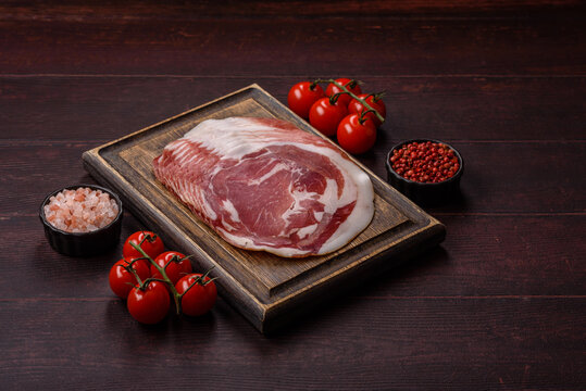 Slices of pork pancetta, ham, or bacon for a festive antipasto platter