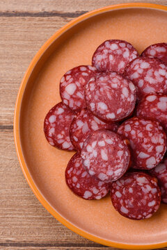 Slices of smoked salami for sandwiches or a lunch spread. Salami slices