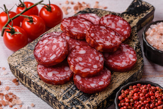 Slices of smoked salami for sandwiches or a lunch spread. Salami slices