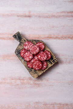 Slices of smoked salami for sandwiches or a lunch spread. Salami slices