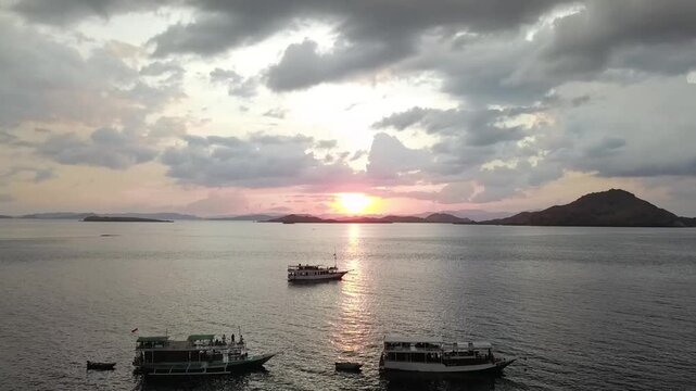 sunset drone view boat in labuan bajo indonesia