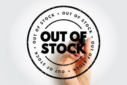 OUT OF STOCK text in a circular rubber stamp held by a person. Retail inventory concept for unavailable products
