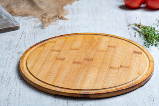 Rustic Vegetable Food Preparation Scene with Wooden Cutting Board
