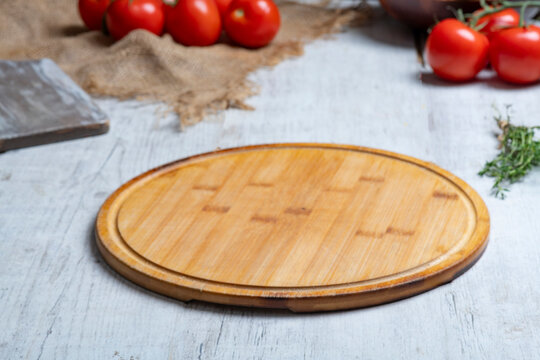Rustic Vegetable Food Preparation Scene with Wooden Cutting Board