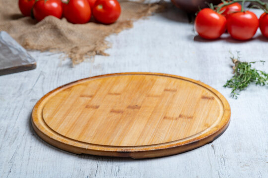Rustic Vegetable Food Preparation Scene with Wooden Cutting Board