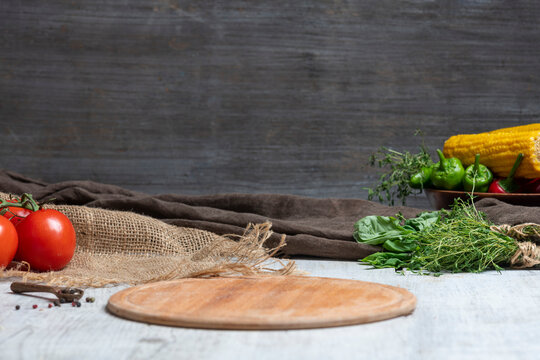 Rustic Vegetable Food Preparation Scene with Wooden Cutting Board