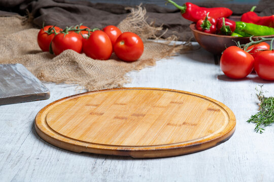 Rustic Vegetable Food Preparation Scene with Wooden Cutting Board