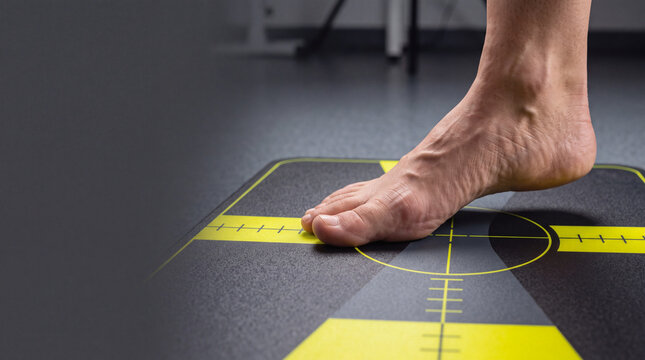 Foot pressing balance plate for cerebellar motor coordination and stability test in clinical rehabilitation