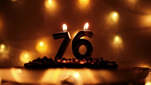 Number candles 76 burn on a cake and are blown out at the end. Warm bokeh lights create a cozy birthday atmosphere