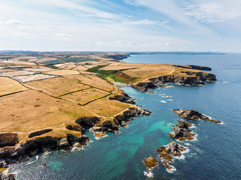 Farms and Fields over Cliffs and Porthcothan Bay from a drone, Porthcothan, Padstow, Cornwall, England, United Kingdom, Summer 2026
