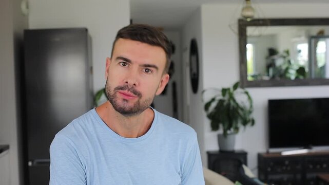 Man making a coned shape with his tongue at camera.