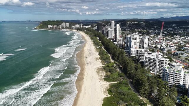 Burleigh Heads aerial drone footage over the point, beach and Surfers Paradise skyline, Gold Coast, Queensland Australia