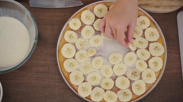 Mother and daughter bake layered cake together in cozy sunlit kitchen, 25 fps