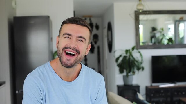 Man listening attentively with his hand on his chin before having a sudden realization and smiling.