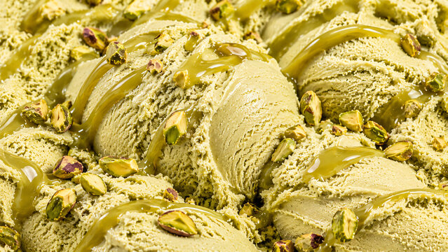 Creamy pistachio ice cream topped with roasted pistachios and glossy pistachio syrup
