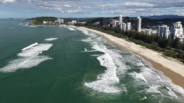 Top down aerial footage of waves breaking on the sand at Burleigh Heads, Gold Coast, Queensland Australia