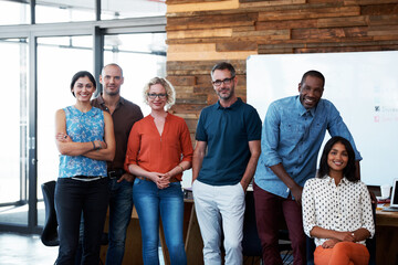 Obraz premium Happy, portrait and team with business people in office for solidarity, about us or diversity. Community, staff and collaboration with group of employees for support, pride and partnership together