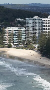Burleigh Heads aerial drone footage over the point, beach and Surfers Paradise skyline, Gold Coast, Queensland Australia - vertical video