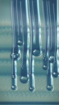 Vertical blue lines with water droplets. 2d animation