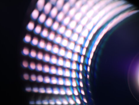 Spectrum LED lamp with shifting glow. Soft light diffusion and prism-like reflections give the image a futuristic, high-tech feel. Can be used as elements for design projects.