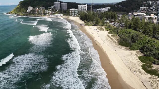 Top down aerial footage of waves breaking on the sand at Burleigh Heads, Gold Coast, Queensland Australia