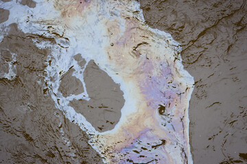 Fototapeta premium Abstract water reflection with iridescent color and rippling texture creating fluid natural pattern