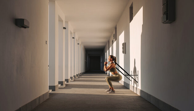 Woman Practicing Wall Squats