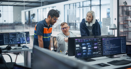 Naklejka premium Multiracial Software Engineers, Including an Indian Man, a Caucasian Man, and a Blonde Caucasian Woman With Headphones, Discuss Program Code and Data Flow Diagrams on Multiple Monitors in Tech Office