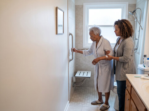 Daughter Helping Elderly Mother With Bathing Safety