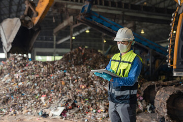 Fototapeta premium Engineers inspect municipal waste for renewable energy.