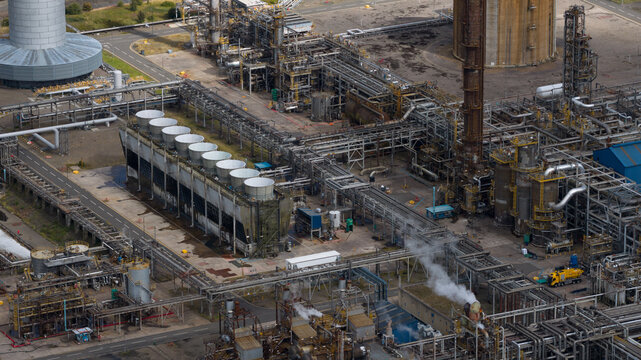 Aerial view of Mossmorran Natural Gas Liquids NGL Plant featuring complex industrial infrastructure, extensive piping networks, and cooling towers in Dunfermline, Scotland, United Kingdom.