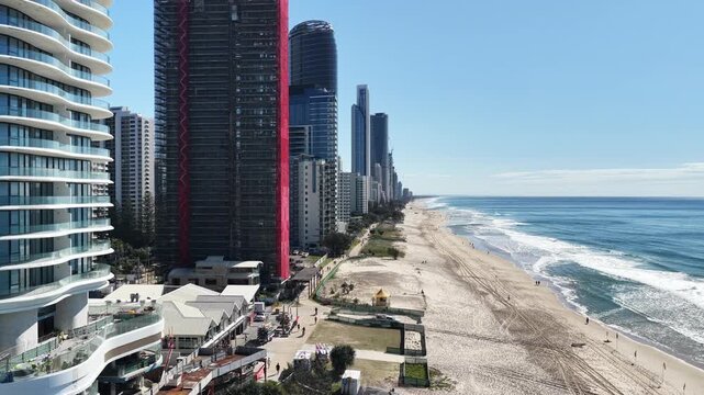 Surfers Paradise aerial drone footage over the beach, surf and high-rise skyline, Gold Coast, Queensland Australia