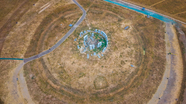 Aerial view of Stonehenge, a prehistoric monument consisting of a ring of standing stones surrounded by grassy fields and pathways in Salisbury, England, United Kingdom.