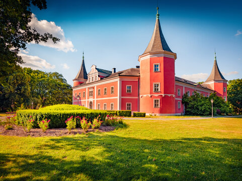 Colorful morning view of Sokolov palace with green meadow. Picturesque summer cityscape of Sokolov - town in the Karlovy Vary Region, Czech Republic, Europe. Traveling concept background.